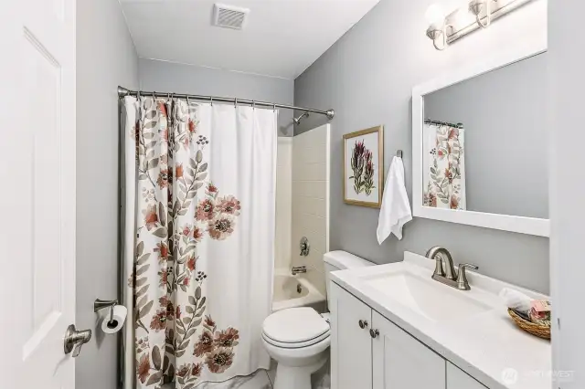 Full bathroom, positioned on the second floor to accommodate the secondary bedrooms. Chrome finishes throughout.