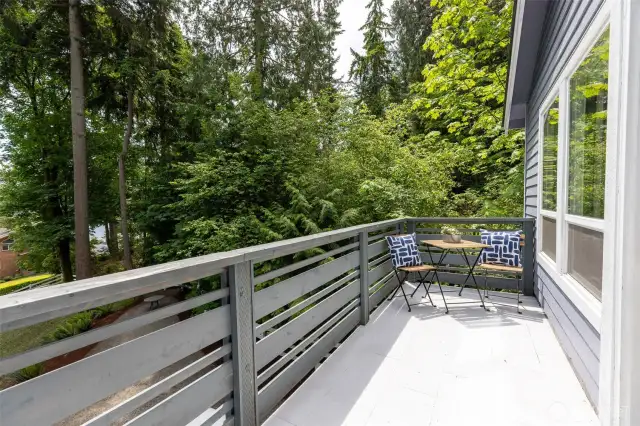 Private deck off of the primary suite, offering serene views of Agate Passage and the neighboring forest canopy.