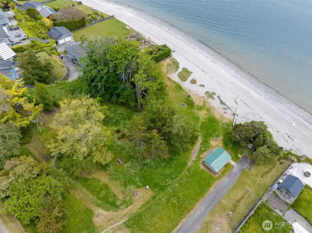 Aerial view of Old Man House. At one time, it was home to the famous Suquamish chiefs Kitsap and Seattle. It now serves as public beach access, walkable to the home.