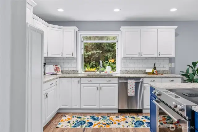 Light and bright kitchen, with atrium style garden window above sink, perfect for herbs, indoor plants or decorations.