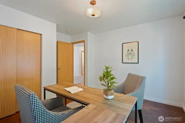 A second view of the 3rd bedroom, looks towards the entry, that's the laundry room door you can see