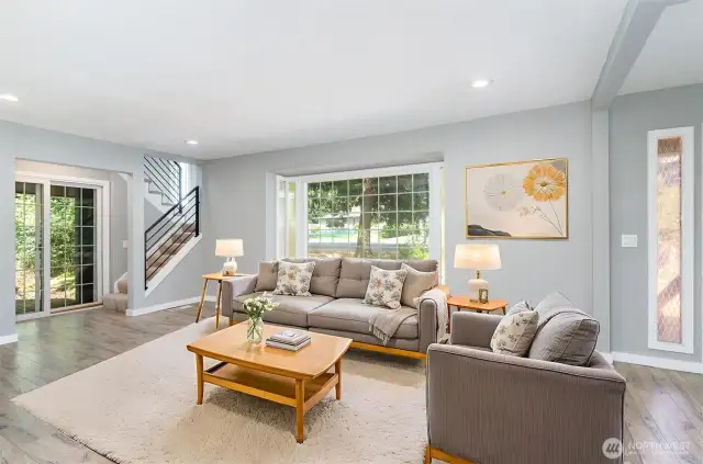 Large living room window and slider ample natural light. **Virtually Staged**
