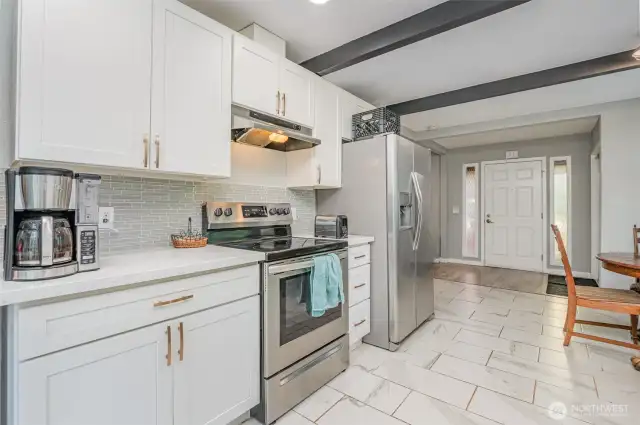 Kitchen features beautiful finishes and stainless steel appliances.