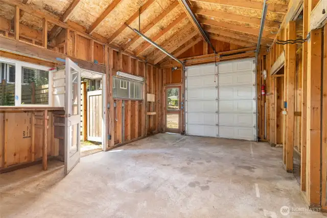 Inside of detached garage with plenty of space for storage.
