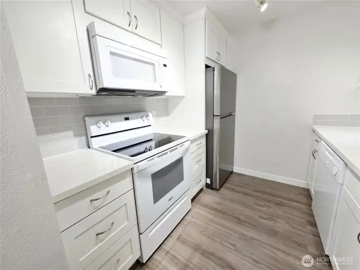 Completely remodeled with new cabinets, countertops, backsplash and appliances.