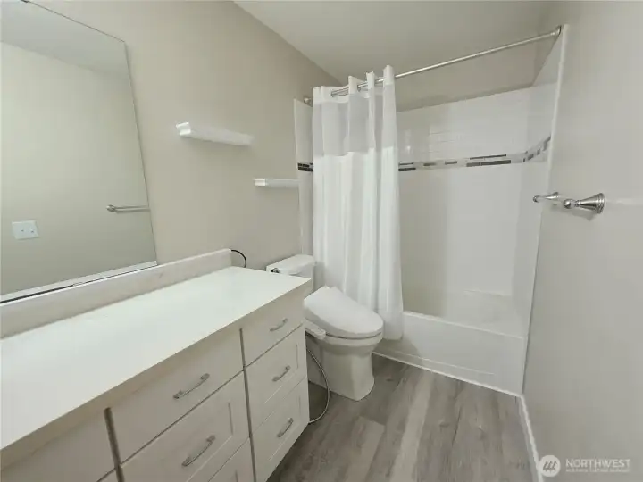 Gorgeous bathroom with tile shower.