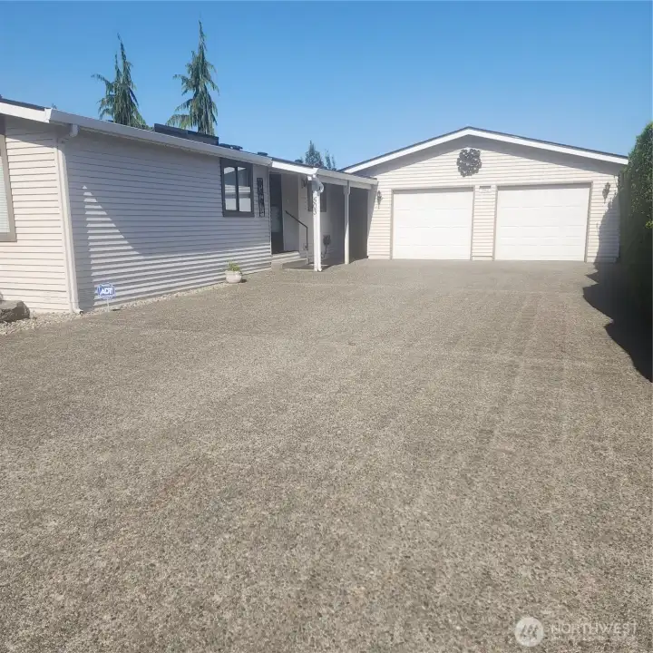 Huge concrete driveway and oversized 2 car garage.
