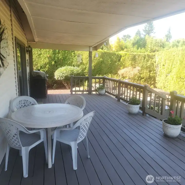 One of many highlights is the covered back deck opening to private back patio and gardens.