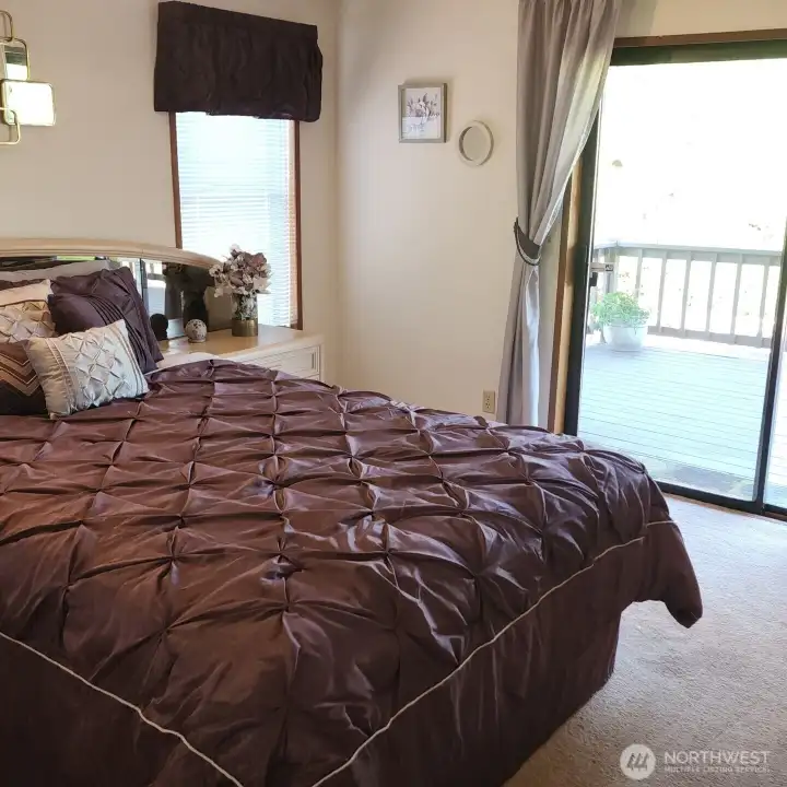 Primary Bedroom with sliding door to covered deck.