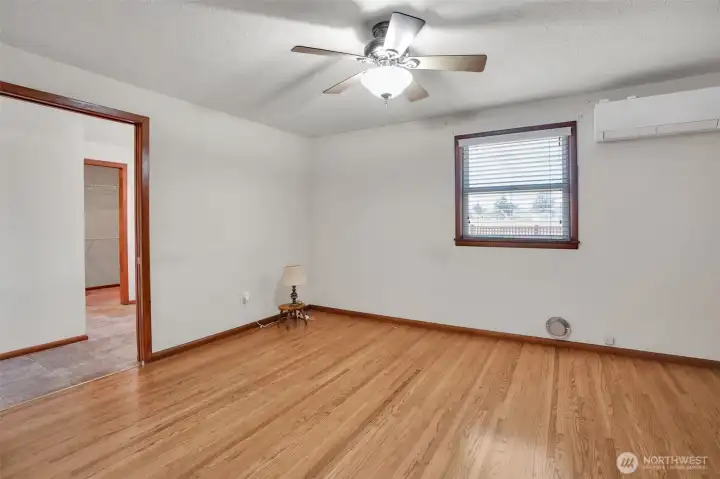 Primary bedroom looking into primary bath and walk in closet.