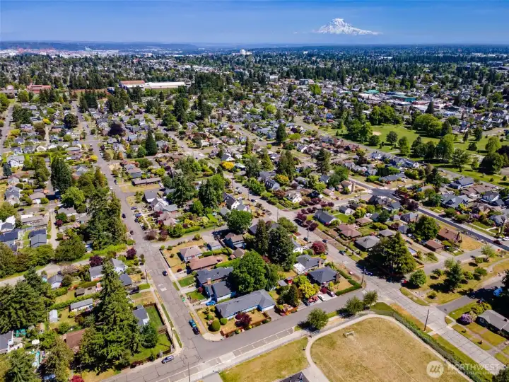 Drone shot with UPS at the top left and Mt. Rainier peaking out to say "Welcome!"