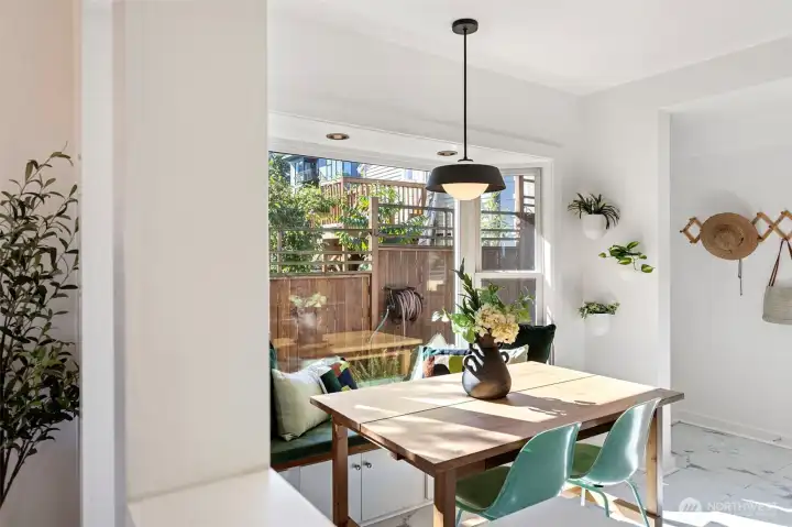 Dining area of eat in kitchen, complete with built in bench area