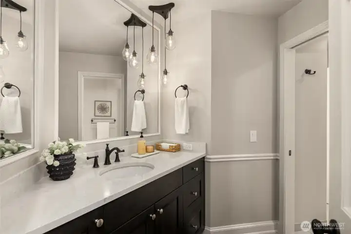 3/4 bathroom on the main floor has a separate room for the shower, that can be closed off should you just want a 1/2 bath for visitors.