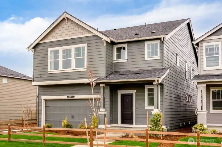 Stunning two-story home exterior. Photos are representative only and may display different color packages and/or upgrades.