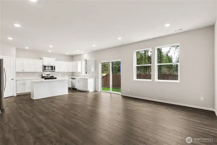 Stunning open-concept layout showcasing the full kitchen with great room that will be great for entertaining. Photos are representative only and may display different color packages and/or upgrades.
