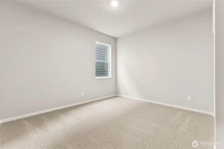 Generously sized secondary bedroom. Photos are representative only and may display different color packages and/or upgrades.