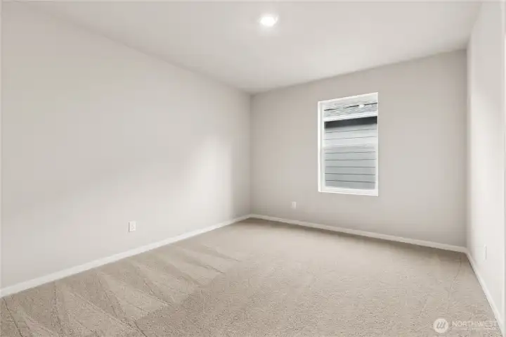 Comfortable secondary bedroom. Photos are representative only and may display different color packages and/or upgrades.