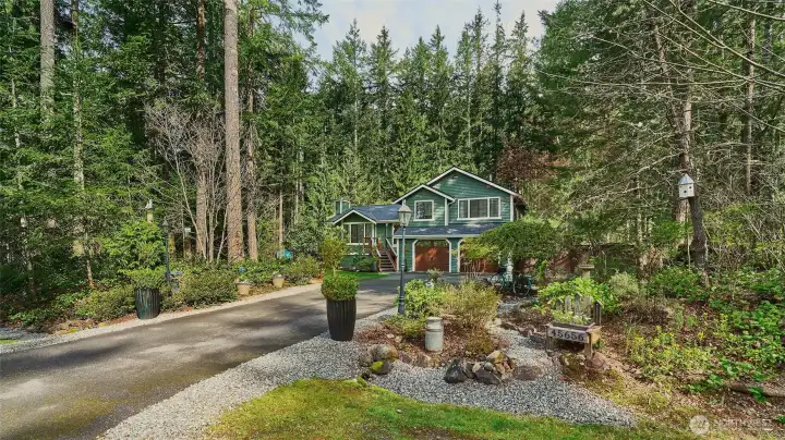 Peaceful North Bend setting at the base of Mount Si surrounded by lush greenery and peakaboo mountain views.