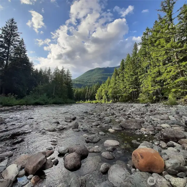 Scenic view of the Middle Fork Snoqualmie River, which residents can enjoy through private community access for peaceful recreation and nature appreciation year-round.