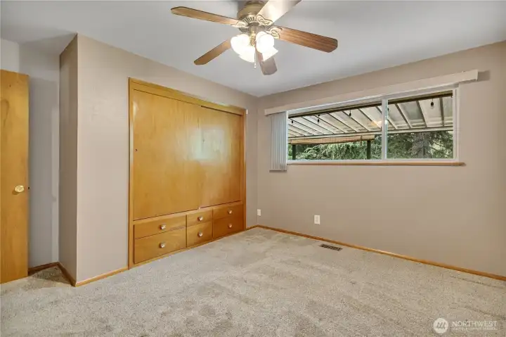 1 of 3 bedrooms with a ceiling fan for added comfort