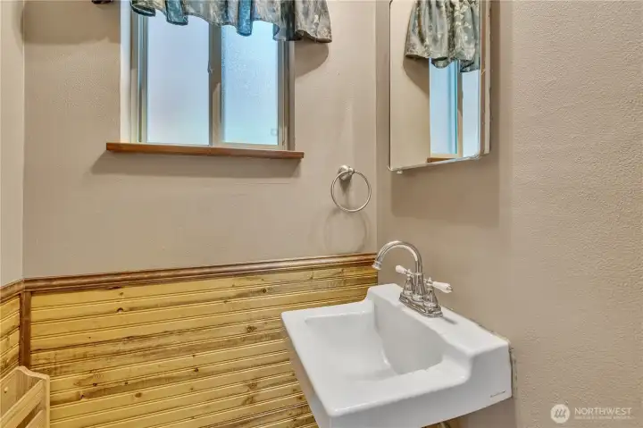 1/2 bath off the lower living room for downstairs convenience or entertaintining