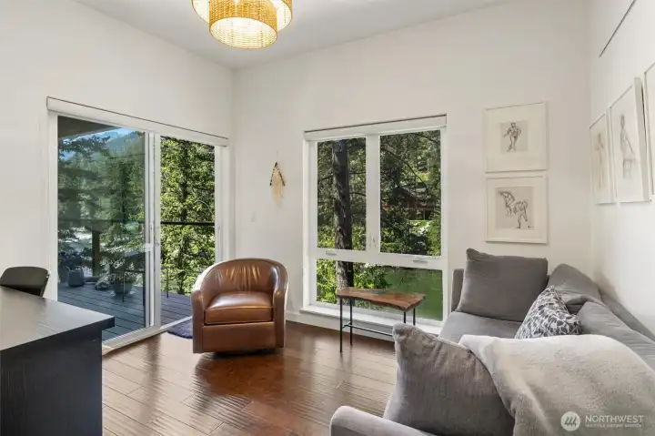 2nd bedroom that has its own direct access to the deck overlooking the river and such a tranquil way to enjoy such captivating such a stunning setting.  And both of the additional bedrooms are on the opposite end end of the house from the primary bedroom which provides as much privacy possible.