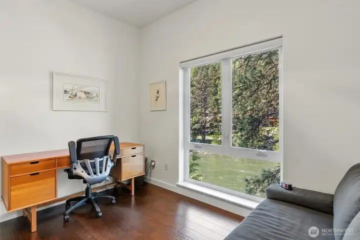 The third bedroom also has stunning views of the river and outdoors. What a perfect way to relax as you fade to sleep.  And both of the additional bedrooms are on the opposite end end of the house from the primary bedroom which provides as much privacy possible.