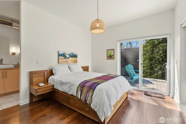 The primary bedroom with ensuite and private deck with it's own hot tub!