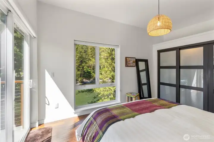 The primary bedroom with ensuite and private deck with it's own hot tub!