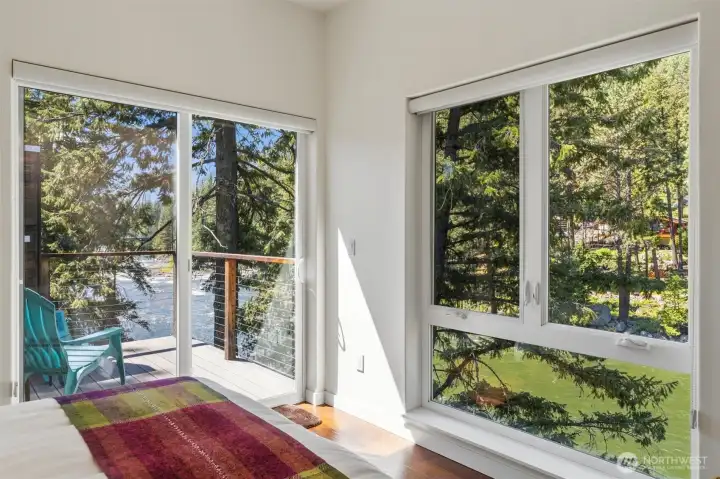 The primary bedroom with ensuite and private deck with it's own hot tub!