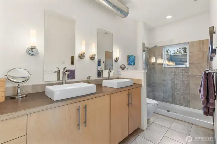 The primary bedroom with ensuite and private deck with it's own hot tub!