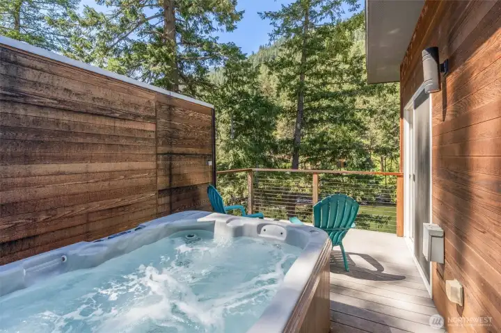 The primary bedroom with ensuite and private deck with it's own hot tub!