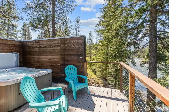The primary bedroom with ensuite and private deck with it's own hot tub!