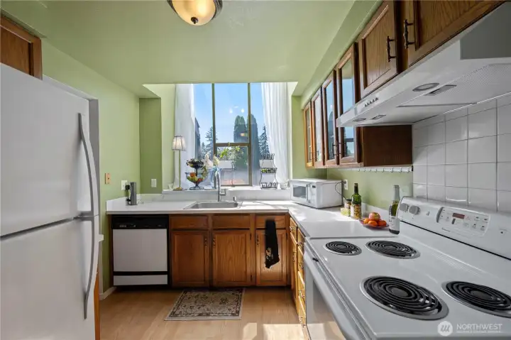 Oak cabinets and a large sunny window