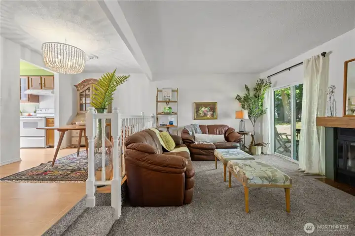 Spacious living area positioned in a prime, sunny location within the complex, offering serene views of the shared green space