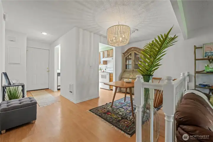 Step up to entry way, kitchen and eating area.