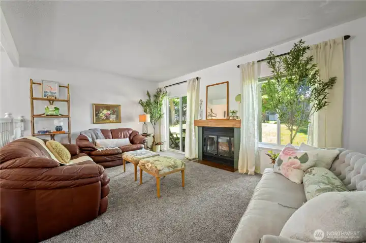 Family room looks onto back green inner courtyard area.