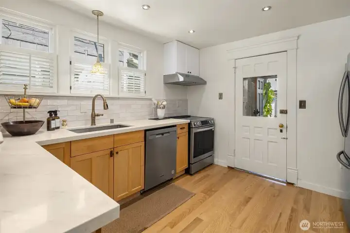 Updated Kitchen, mNew Oak floors, new Quartz counters, and New stainless appliances