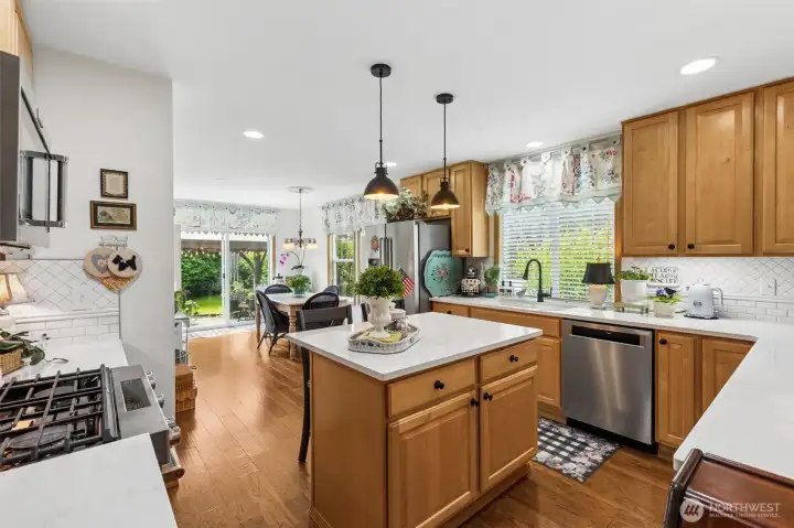 Kitchen features island with seating for two.