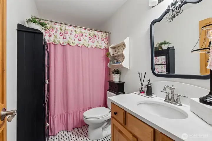 Second bath with tub/shower combo and quartz counters.