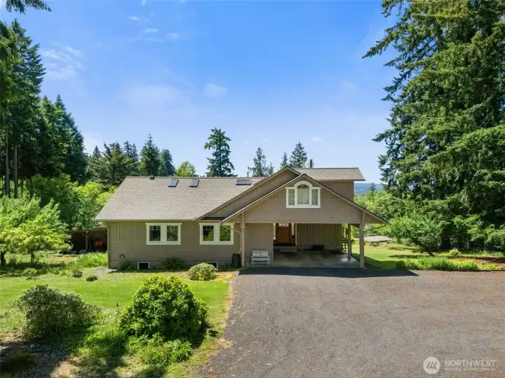 Welcome home to this impressive country property offering over 4,000 square feet of living space and beautiful territorial views. Traditional craftsmanship, mature landscaping, and room to enjoy a peaceful rural lifestyle.  The 2.5+ acres features gardens, fruit trees, pasture area, and room for future improvements.