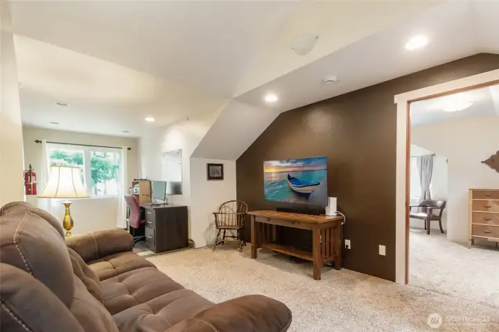 his versatile upper-level retreat offers the perfect blend of comfort and functionality, featuring a cozy reading nook or office area alongside a private room currently used as a peaceful primary bedroom retreat. Filled with character and flexibility, the space is ideal for a library, home office, hobby room, guest accommodations, or a private getaway.