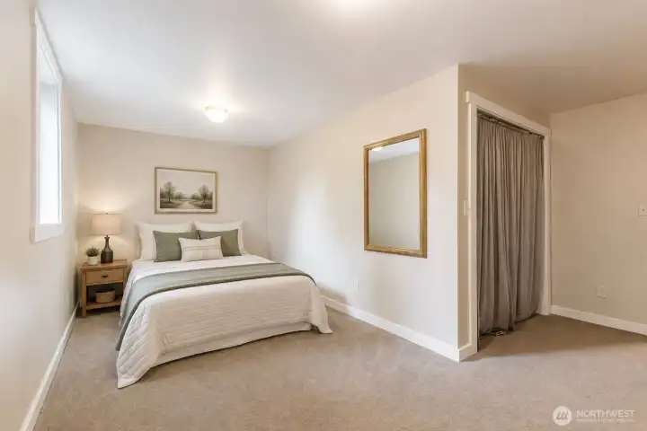 Lower-Level Bedroom 2: Bright and inviting, this well-sized bedroom features ample closet space and natural light, making it ideal for guests, extended living, or everyday use. Its flexible layout allows it to easily adapt to your changing needs and lifestyle. Virtually Staged