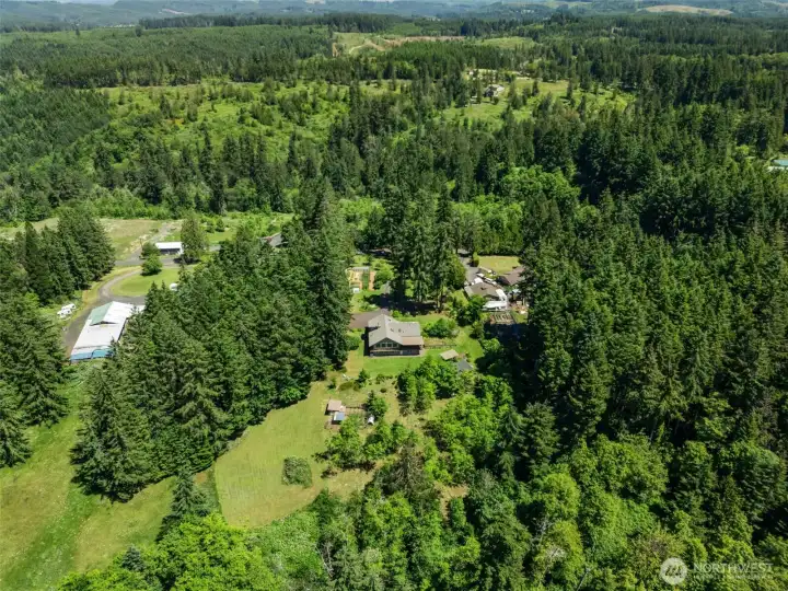 Take in the beauty of the surrounding landscape from above. This bird's-eye view highlights the property's private location, natural scenery, and spacious grounds, offering a glimpse of the tranquility and lifestyle you could enjoy.