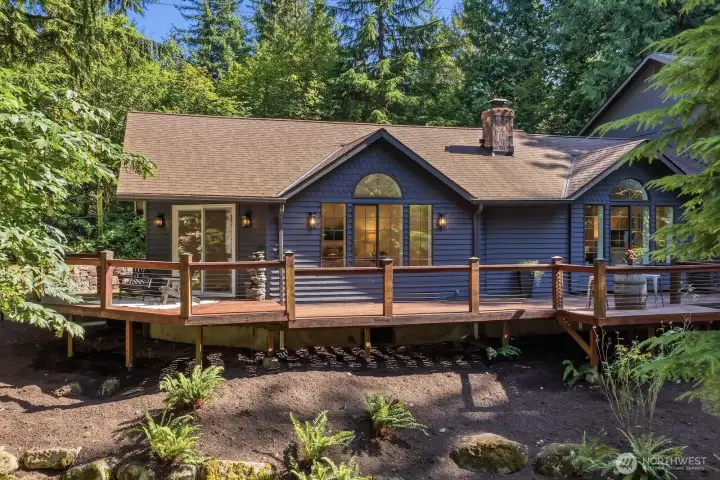 Expansive wraparound deck creates the perfect outdoor retreat for entertaining, or simply enjoying the peaceful surroundings. Expansive wraparound deck creates the perfect outdoor retreat for entertaining, or simply enjoying the peaceful surroundings.