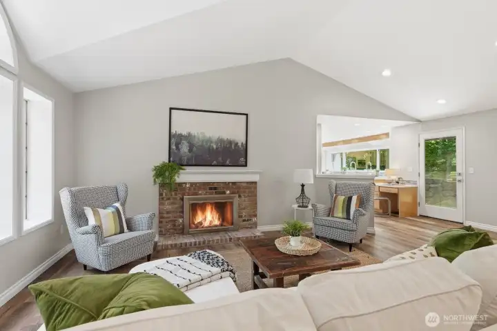 Warm and welcoming living room showcases a cozy wood-burning fireplace and generous space for family and friends. Warm and welcoming living room showcases a cozy wood-burning fireplace and generous space for family and friends.