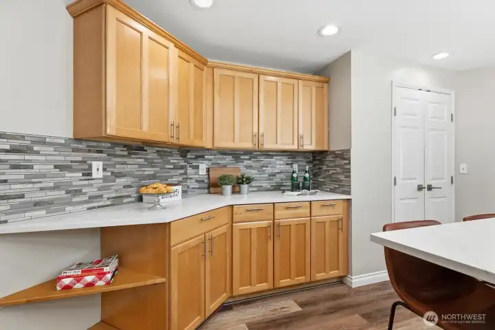 Extended cabinetry and countertop space offer endless flexibility for a coffee bar, serving station, crafts, baking, or entertaining. Extended cabinetry and countertop space offer endless flexibility for a coffee bar, serving station, crafts, baking, or entertaining.