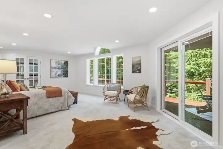Enjoy exclusive access to the wraparound deck through private sliding glass doors, creating a serene escape nestled among the trees. Enjoy exclusive access to the wraparound deck through private sliding glass doors, creating a serene escape nestled among the trees.