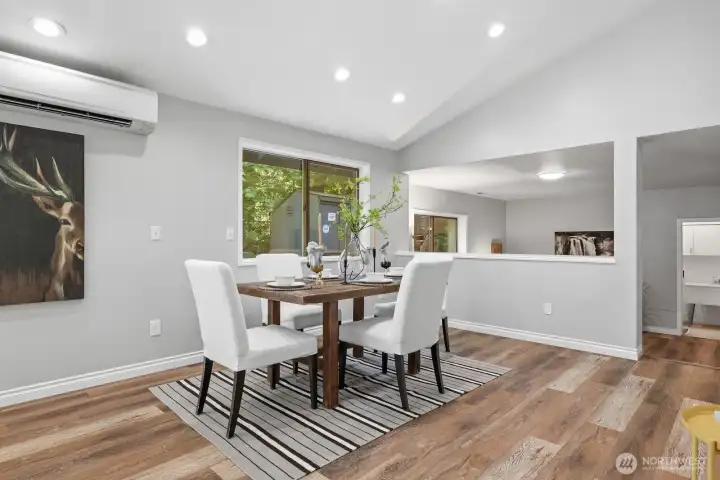 The open half wall creates a bright, airy atmosphere while providing a seamless transition to the inviting lower-level gathering room, maintaining an open, connected feel throughout the home. The open half wall creates a bright, airy atmosphere while providing a seamless transition to the inviting lower-level gathering room, maintaining an open, connected feel throughout the home.
