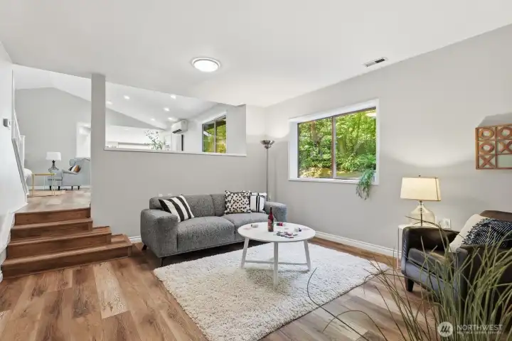 The lower-level family room offers convenient access to the laundry/mudroom and attached garage. The lower-level family room offers convenient access to the laundry/mudroom and attached garage.